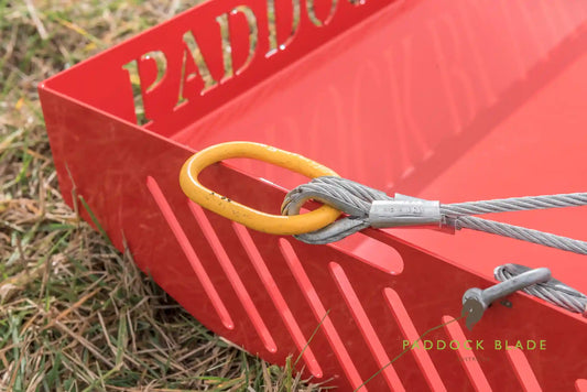 Red Paddock Blade horse paddock cleaner by Paddock Blade UK, showing the durable steel blade designed for paddock maintenance.