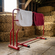 Two horse saddles drying on Electric Heated Horse Rug & Boot Dryer 