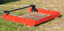 a field cleaner full of horse manure