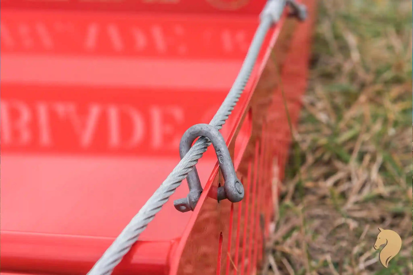 Paddock Blade horse paddock cleaner in signal red, British-made, with a sturdy metal blade for yard and paddock maintenance.