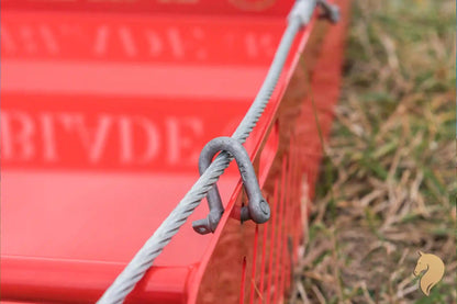 Paddock Blade horse paddock cleaner in signal red, British-made, with a sturdy metal blade for yard and paddock maintenance.
